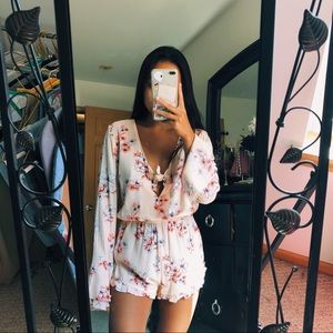 peach floral long sleeve flowy romper